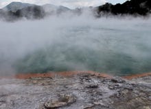 THE CHAMPAGNE POOL, A BUBBLING STEAMING HOT SPRING, GEOTHERMAL WONDERLAND, NEW ZEALAND royalty free stock photo THE CHAMPAGNE POOL, A BUBBLING STEAMING HOT SPRING, GEOTHERMAL WONDERLAND, NEW ZEALAND royalty free stock photo