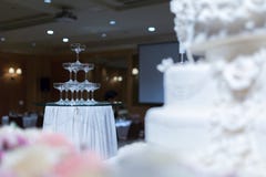 Champagne tower and wedding cake in front of. stock photography Champagne tower and wedding cake in front of. stock photography
