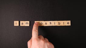 Changing a words `Impossible` to `I`m possible` by hand Stock Images Changing a words `Impossible` to `I`m possible` by hand Stock Images