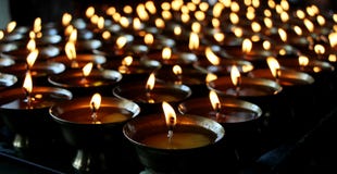 Charity. Praying candles in a monastery in Bhutan.