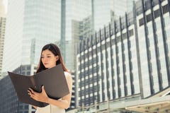 Charming beautiful businesswoman reads paperwork, thinking her w royalty free stock photos Charming beautiful businesswoman reads paperwork, thinking her w royalty free stock photos