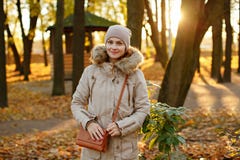 Charming cute and cozy girl in a cap and beige jacket smiling am royalty free stock photo Charming cute and cozy girl in a cap and beige jacket smiling am royalty free stock photo