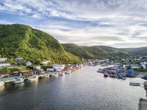 Charming Petty Harbour with green hills and wooden architecture, Newfoundland, Canada royalty free stock photography Charming Petty Harbour with green hills and wooden architecture, Newfoundland, Canada royalty free stock photography