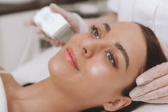 Lovely young woman visiting cosmetologist at beauty clinic stock images Lovely young woman visiting cosmetologist at beauty clinic stock images