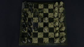 Checkmate. Start Of A Chess Game,the Figures Are Lined Up And A Person Makes The First Move. Hand moving a knight chess royalty free stock image Checkmate. Start Of A Chess Game,the Figures Are Lined Up And A Person Makes The First Move. Hand moving a knight chess royalty free stock image