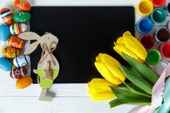 Cheerful, bright, sunny and colorful Easter decorations for home. Everything is ready to celebrate: eggs, flowers, paints, banner stock photo Cheerful, bright, sunny and colorful Easter decorations for home. Everything is ready to celebrate: eggs, flowers, paints, banner stock photo