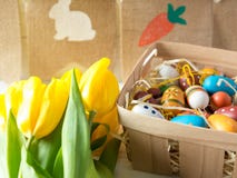 Cheerful, bright, sunny and colorful Easter decorations for home. Everything is ready to celebrate: eggs, flowers, paints, stock photography Cheerful, bright, sunny and colorful Easter decorations for home. Everything is ready to celebrate: eggs, flowers, paints, stock photography