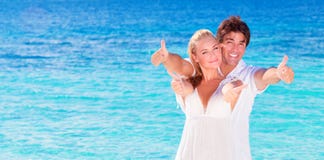 Cheerful couple enjoying beach vacation stock photos Cheerful couple enjoying beach vacation stock photos