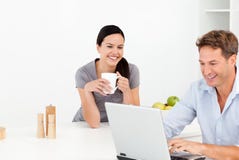 Cheerful Couple Looking At Something On Internet Royalty Free Stock Photos Cheerful Couple Looking At Something On Internet Royalty Free Stock Photos