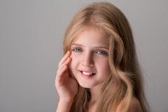 Cheerful cute child is feeling pleasure from her skin stock photo Cheerful cute child is feeling pleasure from her skin stock photo
