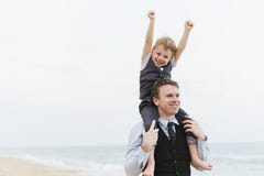 Cheerful family at beach wedding ceremony stock photo Cheerful family at beach wedding ceremony stock photo