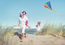 Cheerful Family Playing by the Beach royalty free stock photos Cheerful Family Playing by the Beach royalty free stock photos
