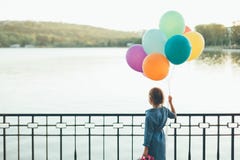 Cheerful Girl Holding Colorful Balloons And Childish Suitcase L Stock Photography