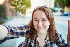 Cheerful girl taking selfie on a street of San Francisco Royalty Free Stock Photo Cheerful girl taking selfie on a street of San Francisco Royalty Free Stock Photo