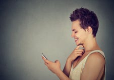 Cheerful modern guy using smart phone smiling royalty free stock images Cheerful modern guy using smart phone smiling royalty free stock images