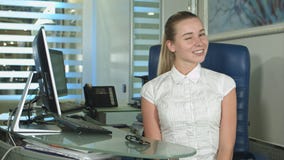 Cheerful office-worker showing thumbs up looking at camera stock image Cheerful office-worker showing thumbs up looking at camera stock image
