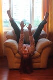 Cheerful plump girl fooling around on the couch royalty free stock image Cheerful plump girl fooling around on the couch royalty free stock image