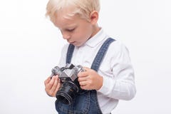 Cheerful small boy is preparing for making photos stock photos Cheerful small boy is preparing for making photos stock photos