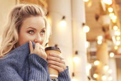 Cheerful woman in the street drinking morning coffee in sunshine light royalty free stock photos Cheerful woman in the street drinking morning coffee in sunshine light royalty free stock photos