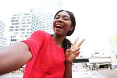 Cheerful young african american woman taking selfie in the city royalty free stock images Cheerful young african american woman taking selfie in the city royalty free stock images