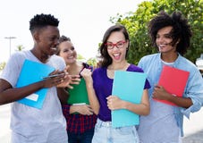 Cheering nerdy student with group of internternational students stock photo Cheering nerdy student with group of internternational students stock photo