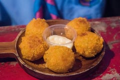Cheese balls with tomato sauce on a plate stock photo Cheese balls with tomato sauce on a plate stock photo
