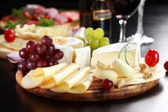 Cheese and salami platter with herbs stock photography Cheese and salami platter with herbs stock photography
