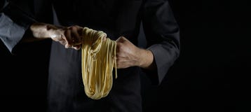Chef Makes Noodles By Hand. Hand Pulled Noodles Stock Photo