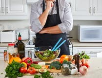 Chef man cooking in the kitchen. Royalty Free Stock Image Chef man cooking in the kitchen. Royalty Free Stock Image