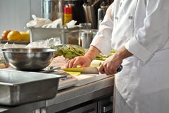 Chef in a restaurant kitchen royalty free stock photography Chef in a restaurant kitchen royalty free stock photography