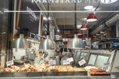 CHELSEA MARKET, NEW YORK CITY, USA - 14 MAY 2018: Young woman, shop, store worker in Chelsea Market stock photos CHELSEA MARKET, NEW YORK CITY, USA - 14 MAY 2018: Young woman, shop, store worker in Chelsea Market stock photos