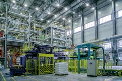 Chemical factory. Thermoplastic production line. Production and packing machinery in large area of industrial hall royalty free stock photo Chemical factory. Thermoplastic production line. Production and packing machinery in large area of industrial hall royalty free stock photo