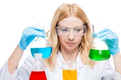 Chemist with multi-colored test tubes on a white royalty free stock photo Chemist with multi-colored test tubes on a white royalty free stock photo