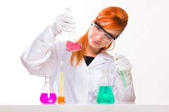 Chemist woman looks at the glass in the lab royalty free stock photography Chemist woman looks at the glass in the lab royalty free stock photography