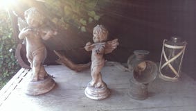 Cherubs statues with heavenly sun rays stock photos Cherubs statues with heavenly sun rays stock photos