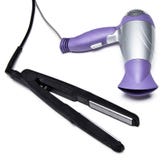Cheveux dénommant le fer et le hairdryer Photo stock Cheveux dénommant le fer et le hairdryer Photo stock