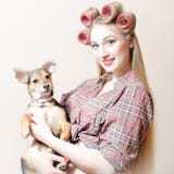 Chick & Puppy: Beautiful Blond Pinup Girl With Red Lips & Curlers In Her Hair Holding A Small Cute Dog Happy Smiling Royalty Free Stock Image Chick & Puppy: Beautiful Blond Pinup Girl With Red Lips & Curlers In Her Hair Holding A Small Cute Dog Happy Smiling Royalty Free Stock Image