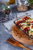 Chicken Casserole of Tomatoes, Onions, Cheese and Spices Menu and Restaurant Concept On Gray Background On the Kitchen Table with stock photo Chicken Casserole of Tomatoes, Onions, Cheese and Spices Menu and Restaurant Concept On Gray Background On the Kitchen Table with stock photo
