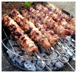 Chicken skewers on a barbecue