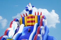 child in an amusement park rides with an inflatable big roller coaster stock images child in an amusement park rides with an inflatable big roller coaster stock images