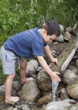 Child At Nature Water Stream Stock Photography