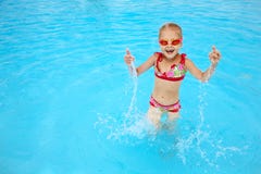 Child in blue water of the swimming pool stock photos Child in blue water of the swimming pool stock photos