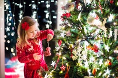 Child decorating Christmas tree stock images Child decorating Christmas tree stock images