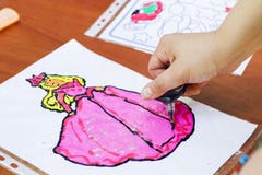 Child draw a woman. Child drawing picture outdoors in summer stock photo Child draw a woman. Child drawing picture outdoors in summer stock photo