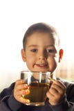 Child Drinking Tea Royalty Free Stock Photography