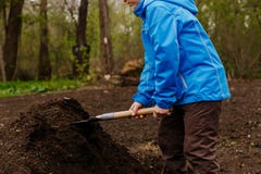 Child is gaining ground with a shovel royalty free stock photo Child is gaining ground with a shovel royalty free stock photo
