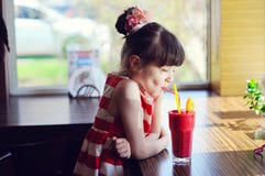 Child girl drinking strawberry smoothie stock images Child girl drinking strawberry smoothie stock images