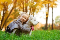 Child Girl Having Fun With Her Dog During Walk In Autumn Park. Lifestyle Portrait Royalty Free Stock Photography