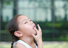 Child girl intend sucking her fingers