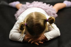 Child Girl Upset Lying On The Floor And Crying On A Black Background Royalty Free Stock Photos Child Girl Upset Lying On The Floor And Crying On A Black Background Royalty Free Stock Photos